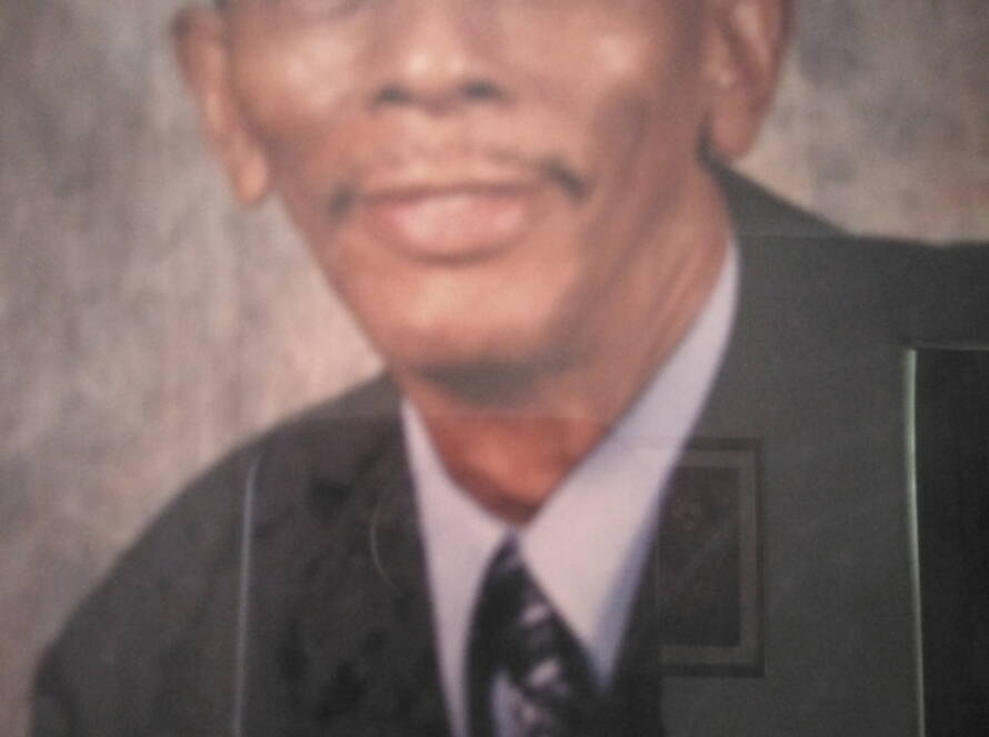 Portrait of a man in a suit.